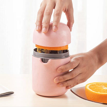 Manual Citrus Juicer with Strainer Ring and Lid 250 ml (Pink)